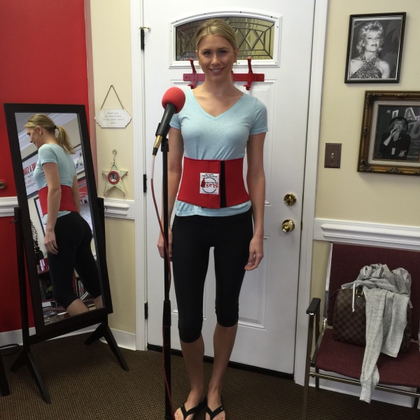 Female Student Using Breathing Belt for singing