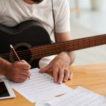 Man writing music