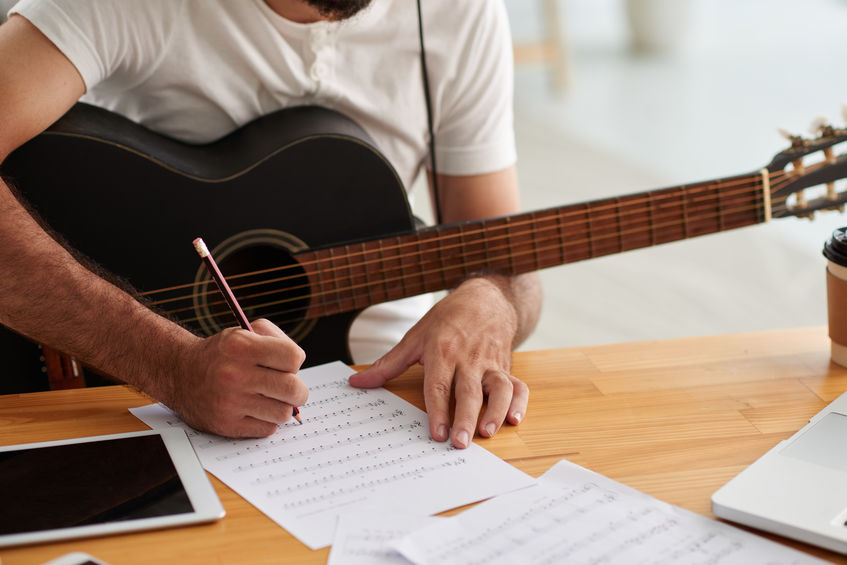 Man writing music