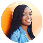 Smiling woman with braided hair against an orange striped background.